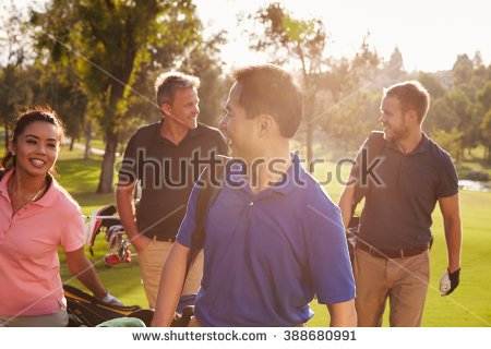 stock-photo-group-of-golfers-walking-along-fairway-carrying-golf-bags-388680991
